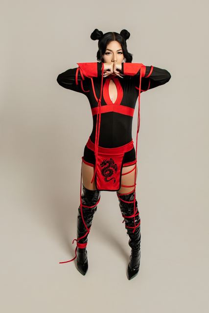 Model in a red and black ninja costume