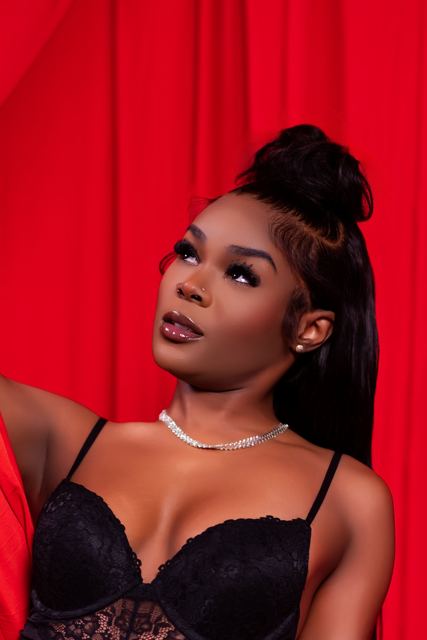 Close portrait against red drapes